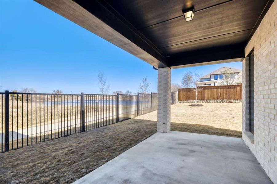 Fenced backyard featuring a patio