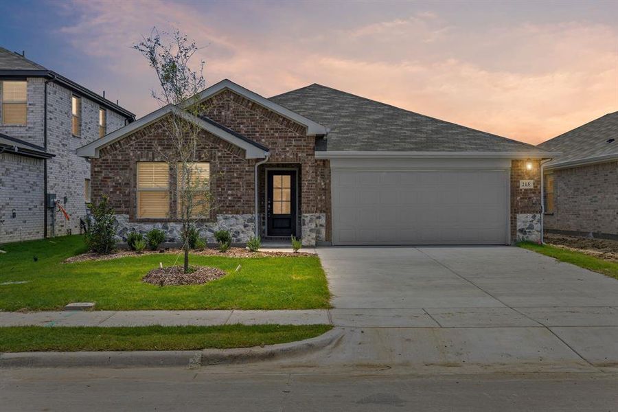 Front exterior of a new home in Stratton Place, Greenville, TX, highlighting curb appeal (Image 20). Front exterior of a new home in Stratton Place, Greenville, TX, highlighting curb appeal (Image 20).
