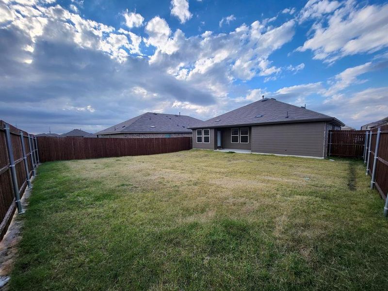 Back of property with a patio and a fenced backyard