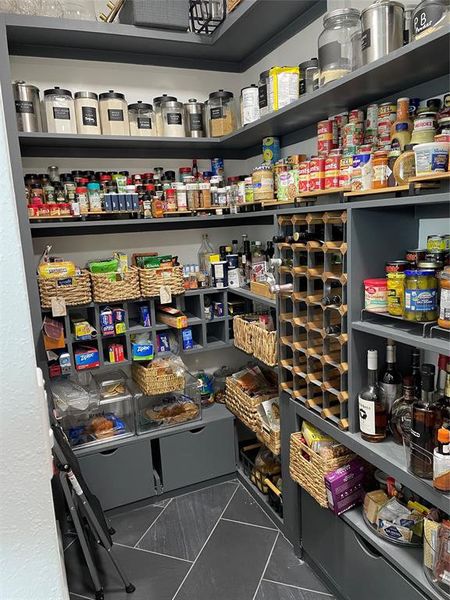 Lots of built in storage in walk in pantry