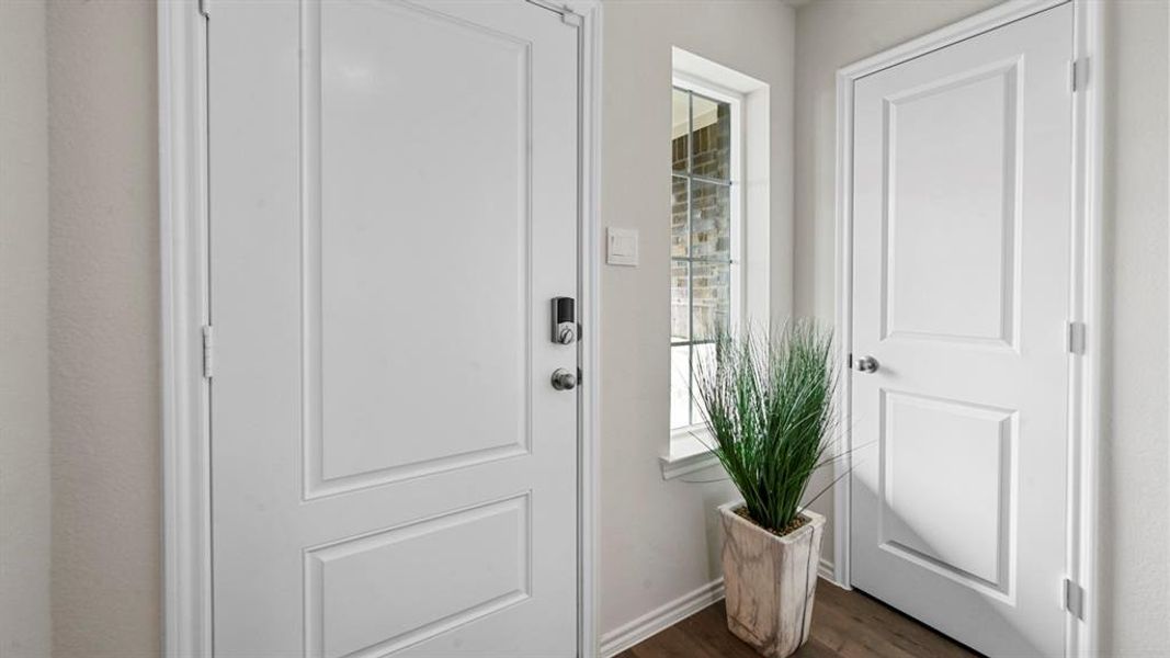 Doorway featuring wood finished floors Doorway featuring wood finished floors