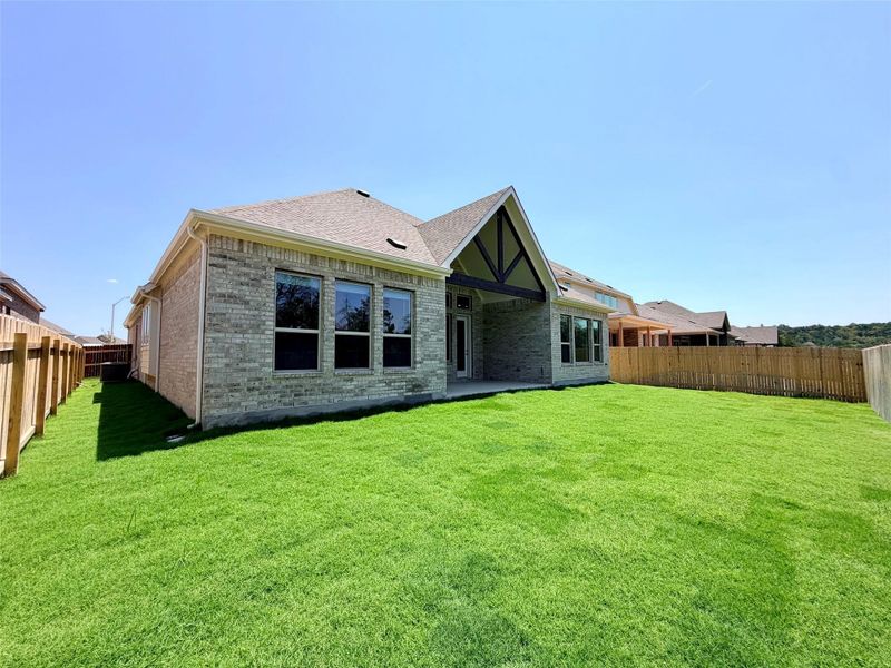Exterior details and patio area of a home in Retreat at San Gabriel, Georgetown (Image 20).