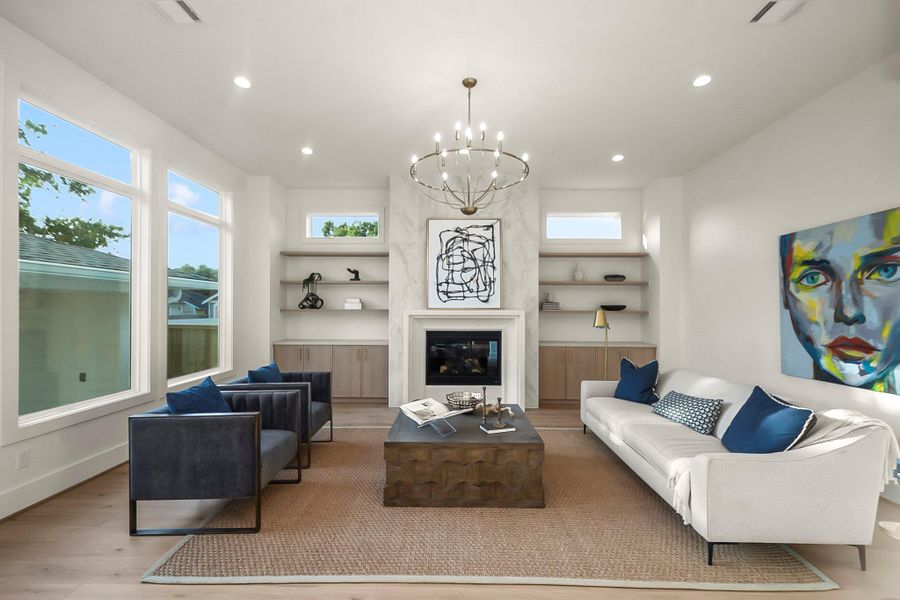 Filled with natural light, the spacious living area creates a warm and inviting atmosphere with room to gather, entertain, or unwind in comfort.