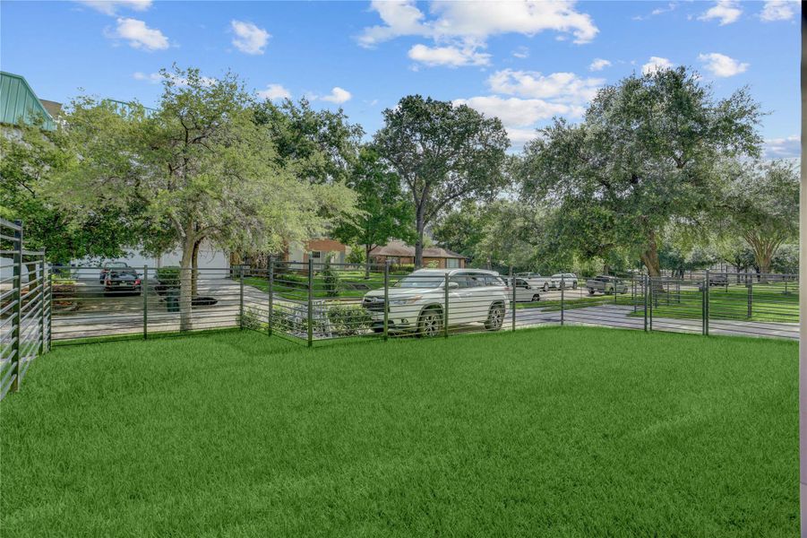 View from 1907 Lauderdale of the fully-fenced yard space with gated access from the driveway or directly from the house.