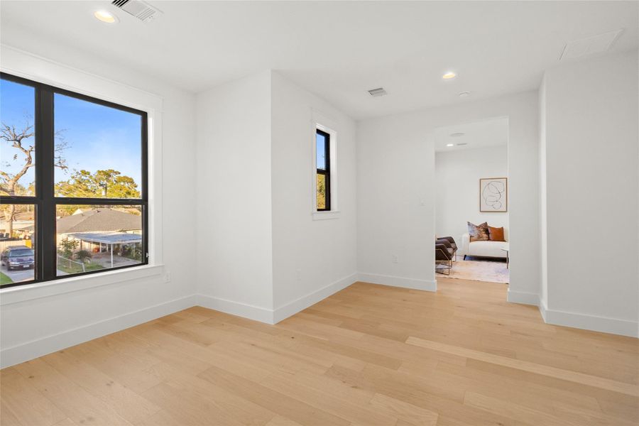 From this angle, you can appreciate how intentionally secluded this speakeasy room feels while still connecting seamlessly to the rest of the home. Natural light filters in through the black-framed window, keeping the space bright while maintaining the sense of privacy that makes it perfect for late-night conversations or quiet escapes.
