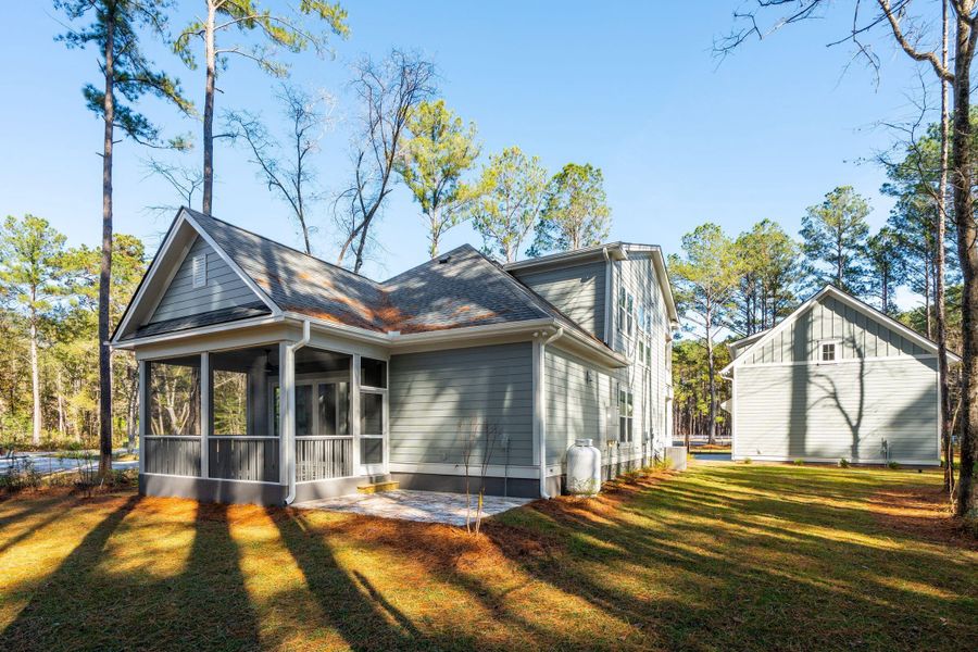 Exterior details and patio area of a home in , Awendaw (Image 39).