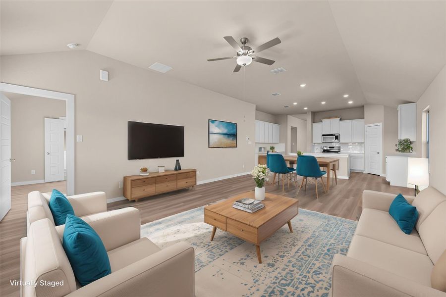 An inviting open-concept living area flows seamlessly into the dining space and a well-appointed kitchen.