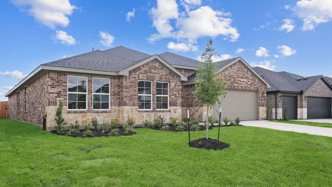 Front exterior of a new home in Tamarron, Fulshear, TX, highlighting curb appeal (Image 2). Front exterior of a new home in Tamarron, Fulshear, TX, highlighting curb appeal (Image 2).