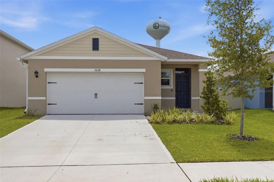 Front exterior of a new home in Concorde, Sanford, FL, highlighting curb appeal (Image 22). Front exterior of a new home in Concorde, Sanford, FL, highlighting curb appeal (Image 22).