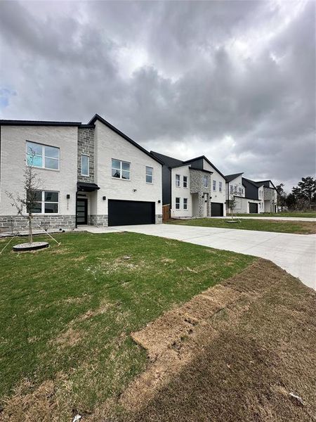 Front exterior of a new home in , Dallas, TX, highlighting curb appeal (Image 17).