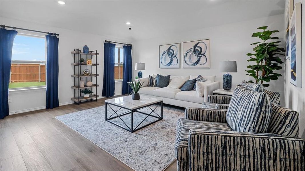 Living room with recessed lighting and wood finished floors Living room with recessed lighting and wood finished floors