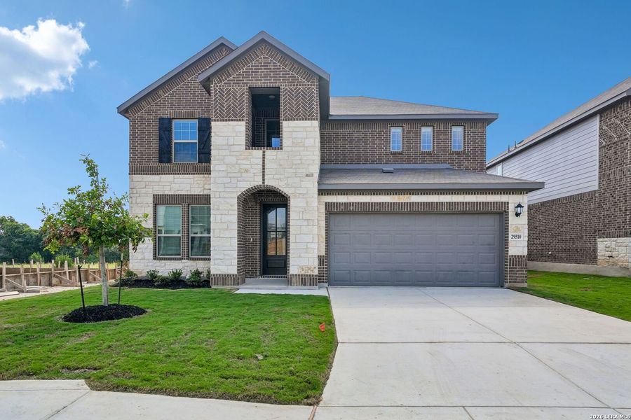 Front exterior of a new home in Fox Falls, Boerne, TX, highlighting curb appeal (Image 27).