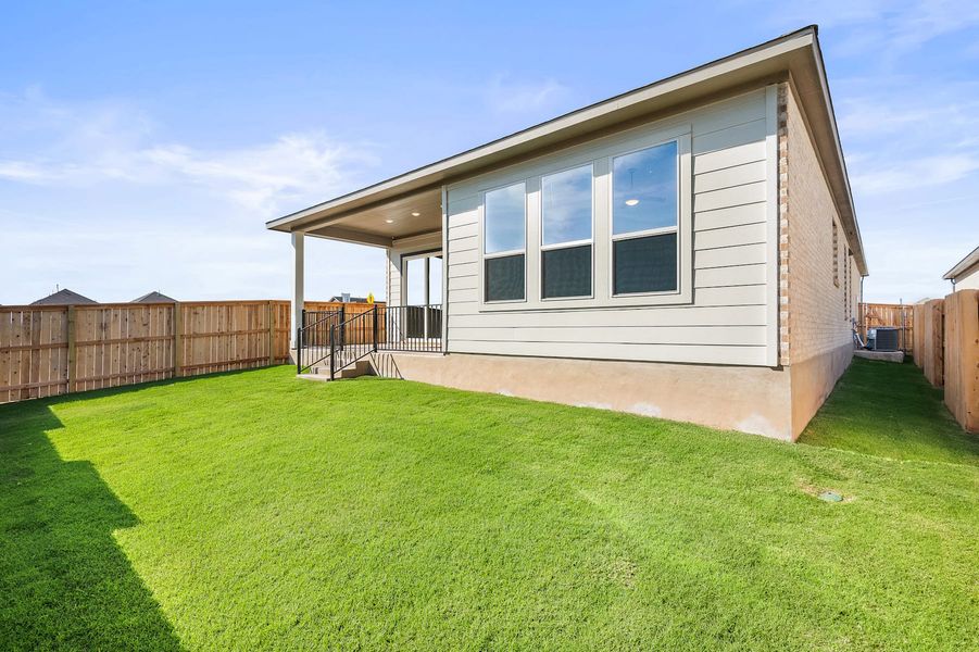 Exterior details and patio area of a home in Lariat, Liberty Hill (Image 25).