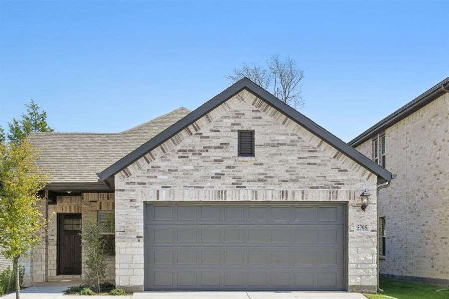 Front exterior of a new home in Eastridge - Spring Series, McKinney, TX, highlighting curb appeal (Image 2). Front exterior of a new home in Eastridge - Spring Series, McKinney, TX, highlighting curb appeal (Image 2).