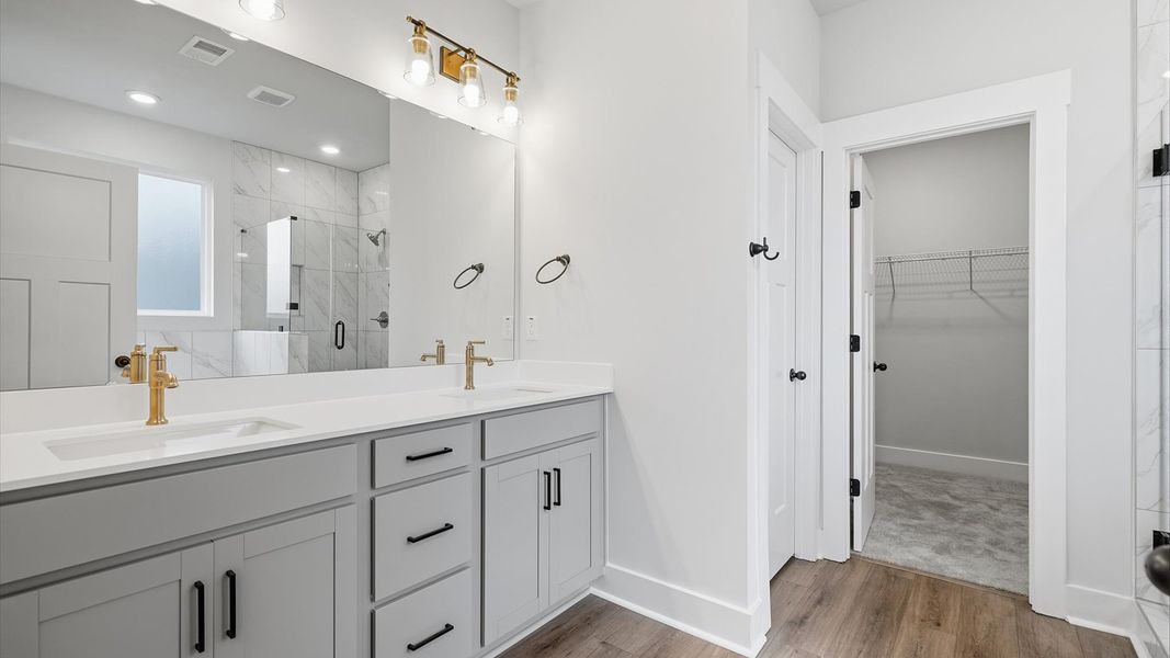 Tasteful primary bath with modern finishes, a walk-in shower, and thoughtful double vanity layout in Piedmont, SC Tasteful primary bath with modern finishes, a walk-in shower, and thoughtful double vanity layout in Piedmont, SC