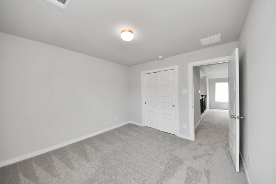 Generously sized secondary bedrooms featuring spacious closets, soft and inviting carpeting underfoot, large windows allowing plenty of natural light, and the added touch of privacy blinds for your personal retreat. Generously sized secondary bedrooms featuring spacious closets, soft and inviting carpeting underfoot, large windows allowing plenty of natural light, and the added touch of privacy blinds for your personal retreat.