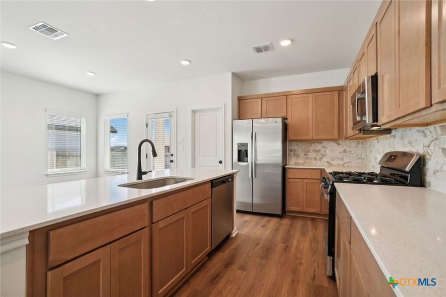 Furnished interior view inside a new home in Village at Three Oaks, Seguin (Image 9).