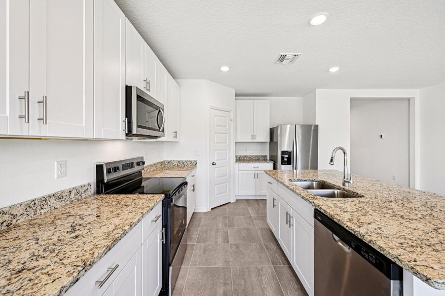 Furnished interior view inside a new home in Hampton Park - Classic Series, Vero Beach (Image 6).