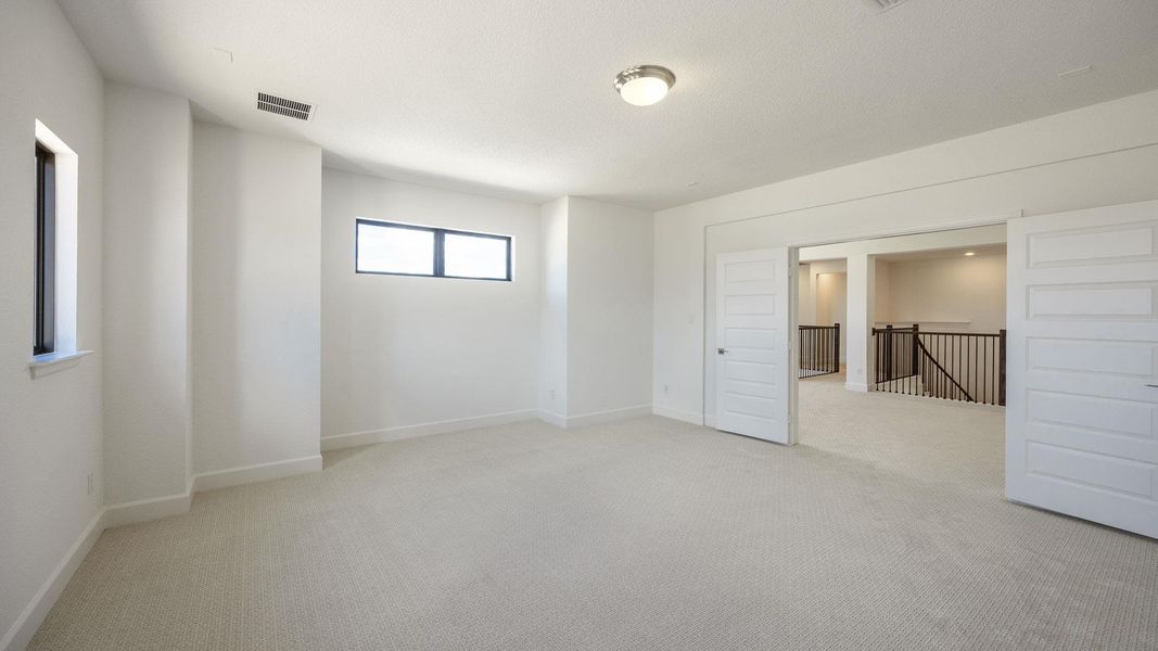 Unfurnished room featuring light carpet Unfurnished room featuring light carpet