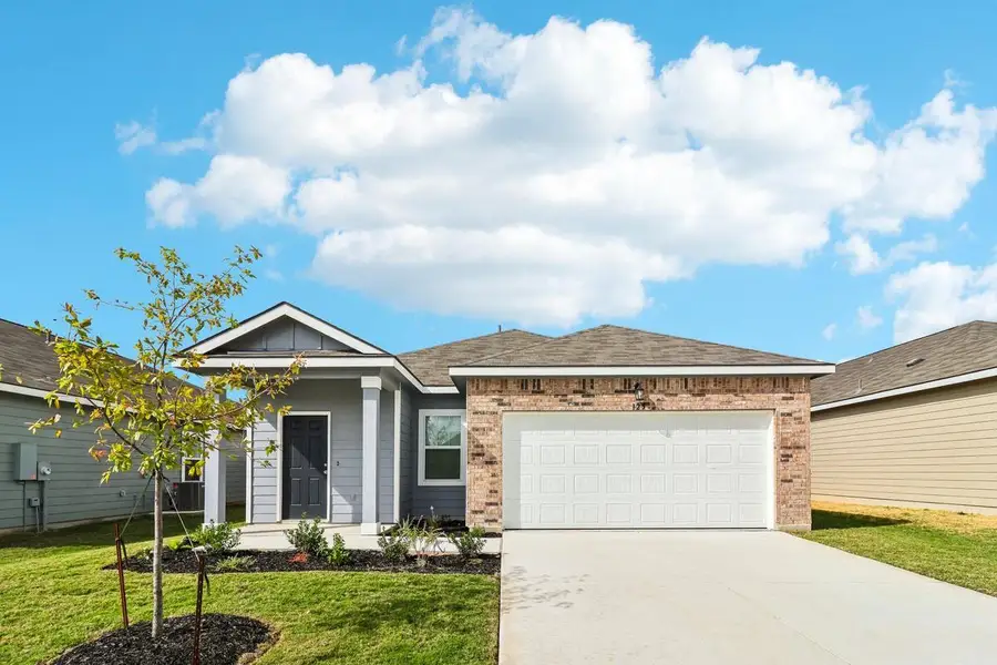 Front exterior of a new home in Willow Springs, Buda, TX, highlighting curb appeal (Image 1). Front exterior of a new home in Willow Springs, Buda, TX, highlighting curb appeal (Image 1).