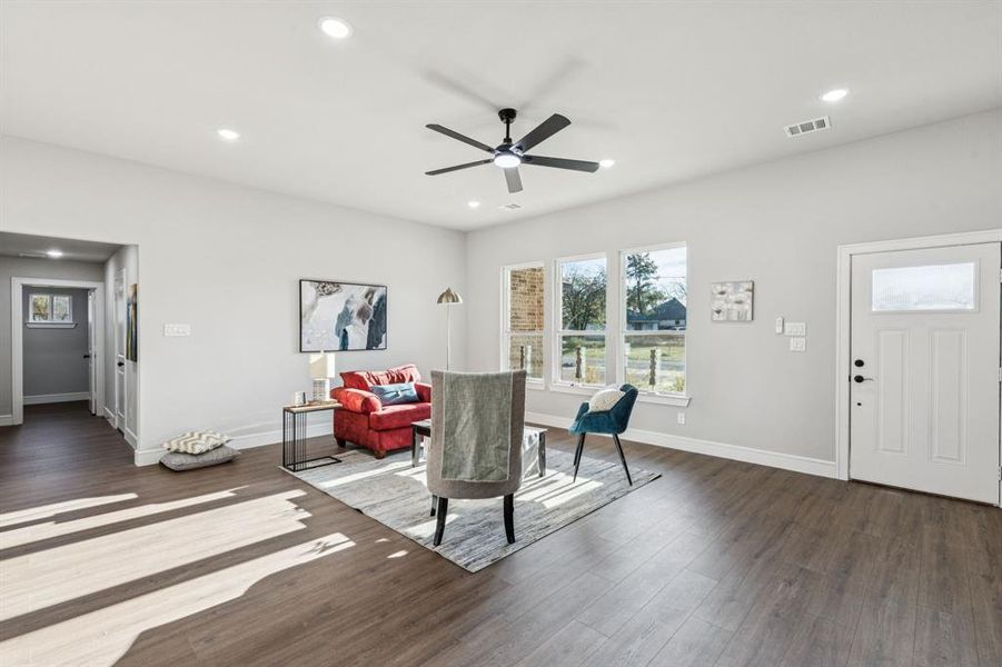 Dining space featuring dark wood-style floors, recessed lighting, a ceiling fan, and plenty of natural light