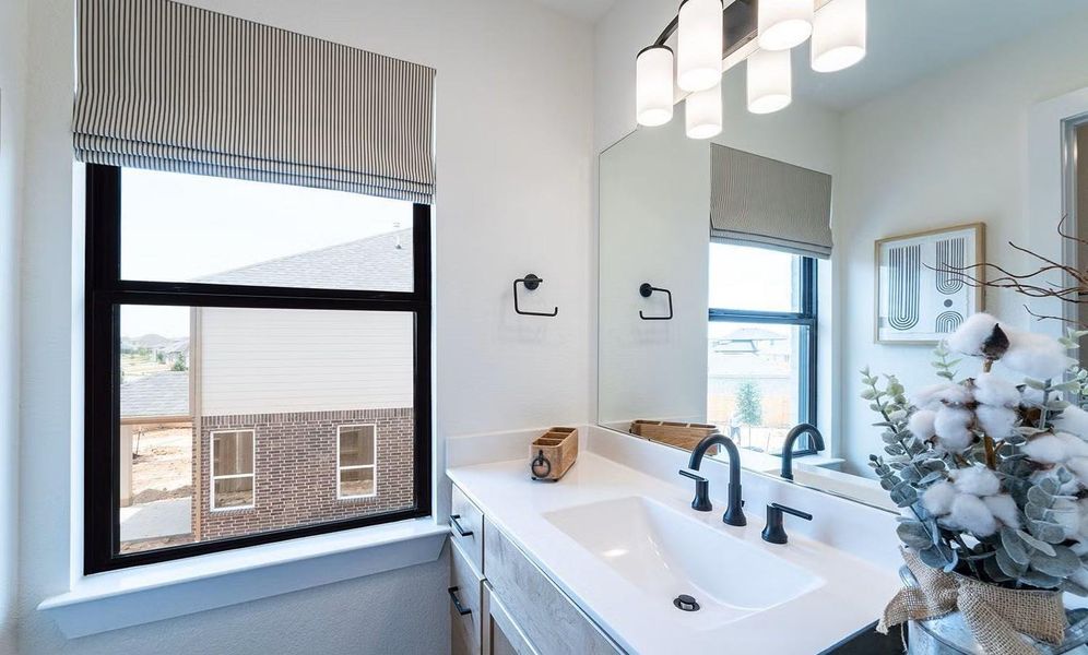 Guest Bedroom with its own private vanity featuring a clean vanity design, modern fixtures, and a comfortable layout for everyday use. **Photos are representative only and may vary as built.**