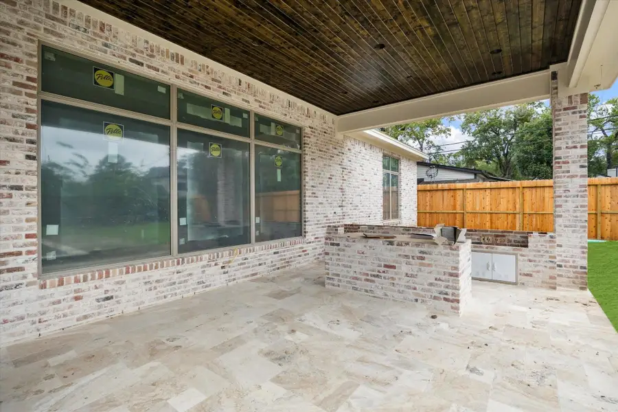 Progress photo from December 2025 - covered patio with outdoor kitchen