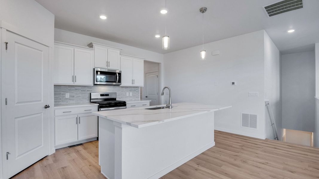 Furnished interior view inside a new home in Trails at Crowfoot, Parker (Image 5).