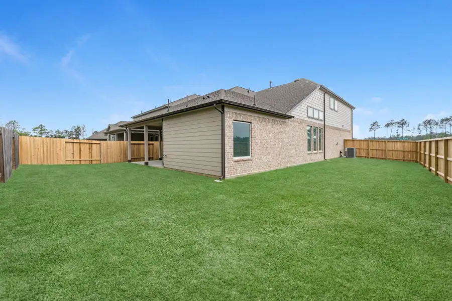 Exterior details and patio area of a home in Barton Creek Ranch, Conroe (Image 3).