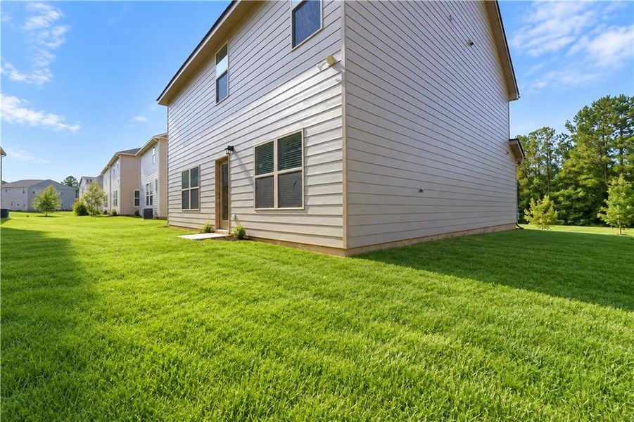Exterior details and patio area of a home in Garden Walk, Jackson (Image 28).
