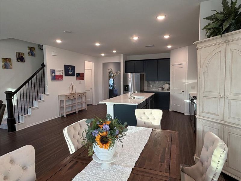 View toward Kitchen. Stairs lead to Game Room, Three Bedrooms and Two Baths
