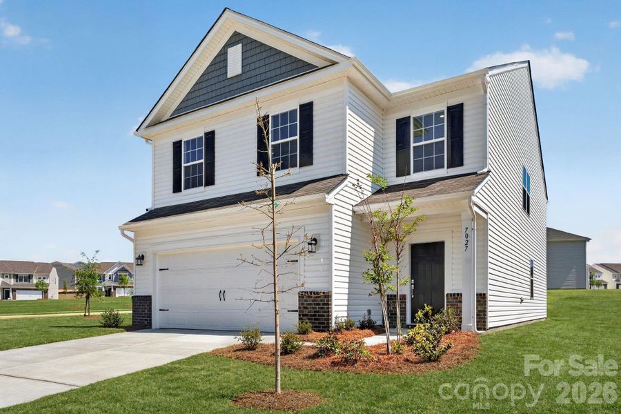 Front exterior of a new home in Shannon Woods, Maiden, NC, highlighting curb appeal (Image 2). Front exterior of a new home in Shannon Woods, Maiden, NC, highlighting curb appeal (Image 2).