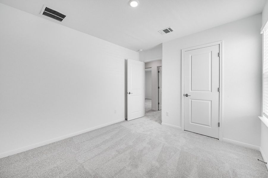 Representative unfurnished interior of a home built from the Sparrow by Taylor Morrison in Turner's Crossing 50s, Austin (Image 26).