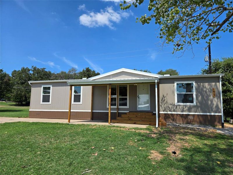 Exterior details and patio area of a home in , Pelican Bay (Image 2).