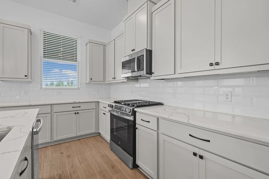 Furnished interior view inside a new home in Bridgeland Chateaus, Cypress (Image 8).