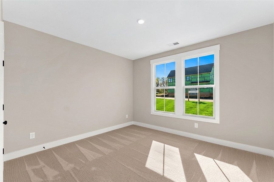 This spacious room features ample natural light an