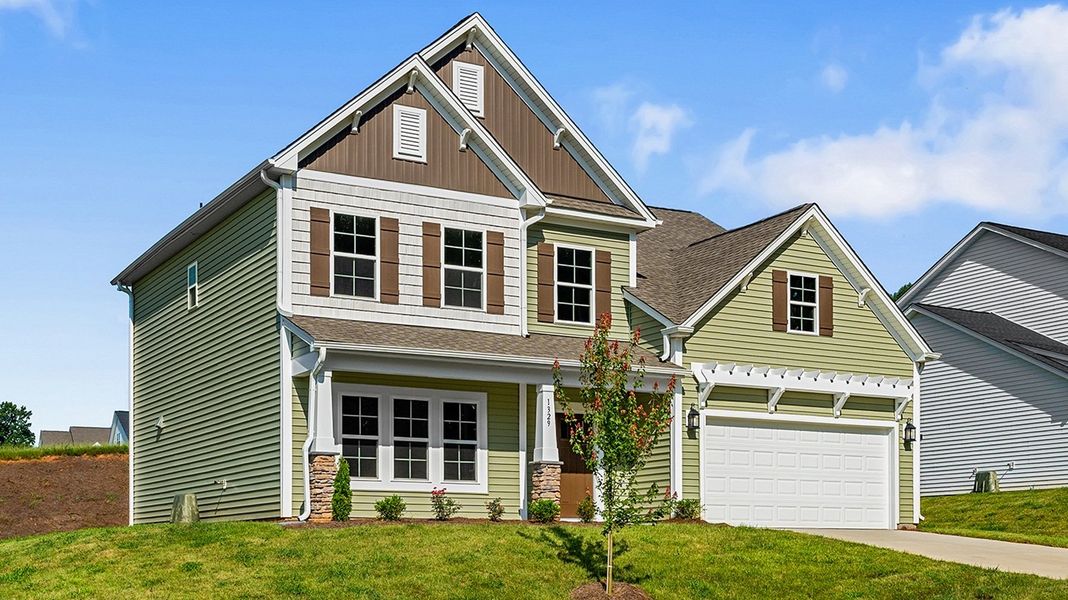 Front exterior of a new home in Brooke Hill, Lewisville, NC, highlighting curb appeal (Image 25).
