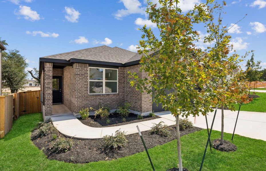 Front exterior of a new home in La Cima, San Marcos, TX, highlighting curb appeal (Image 18).