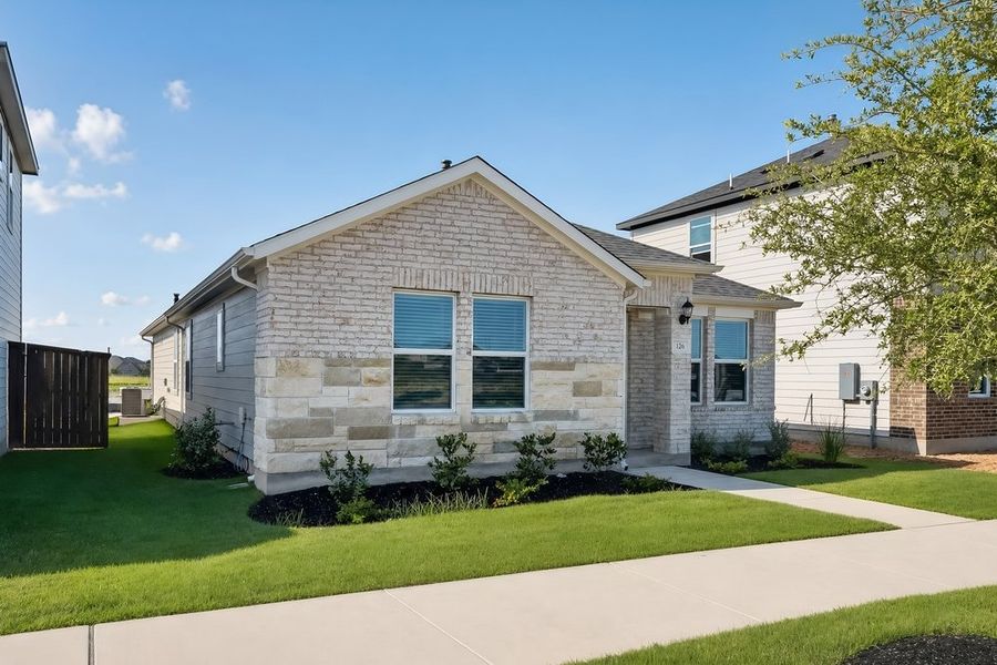 Front exterior of a new home in Emory Crossing, Hutto, TX, highlighting curb appeal (Image 17).
