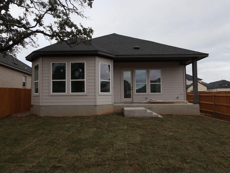 Exterior details and patio area of a home in Heritage, Dripping Springs (Image 8).