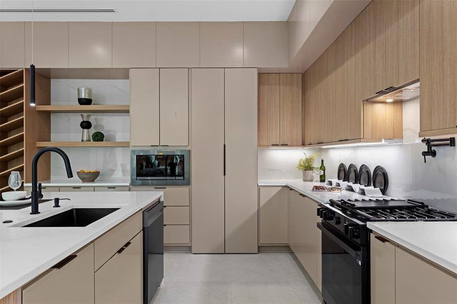 Kitchen featuring light brown cabinets, decorative backsplash, sink, black appliances, and light tile patterned flooring