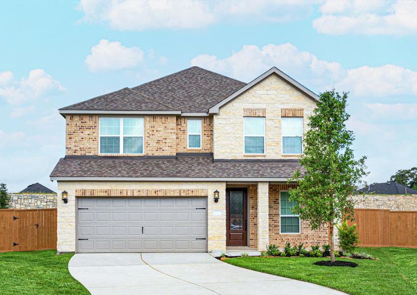 Brick and stone exterior with front yard landscaping