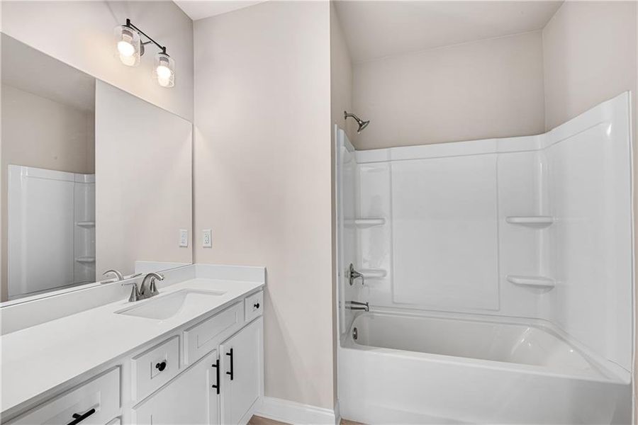 Furnished interior view inside a new home in Hidden Fields, Hoschton (Image 13).