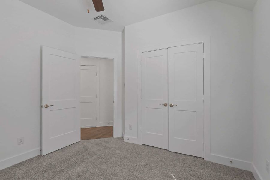 Representative unfurnished interior of a home built from the Carriagehouse by Chesmar Homes in Meridiana Townhomes, Iowa Colony (Image 71).