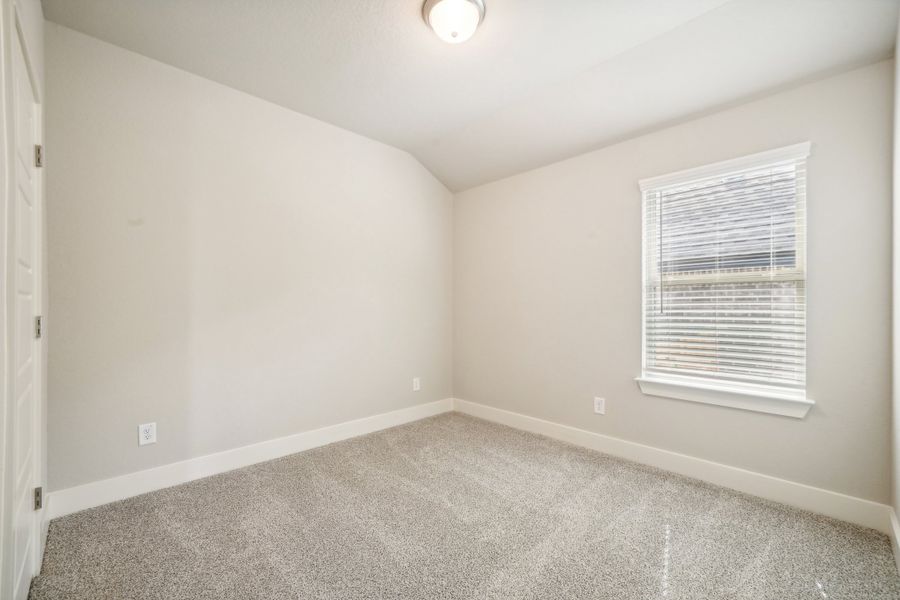 Guest bedroom in the Preston floorplan at a Meritage Homes community.