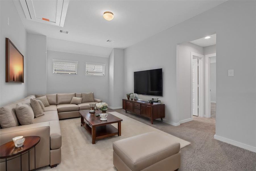 Come upstairs and enjoy a day of leisure in this fabulous game/loft room! This is the perfect hangout spot or adult game room, this space features plush carpet, high ceiling, recessed lighting, custom paint and large windows with privacy blinds.