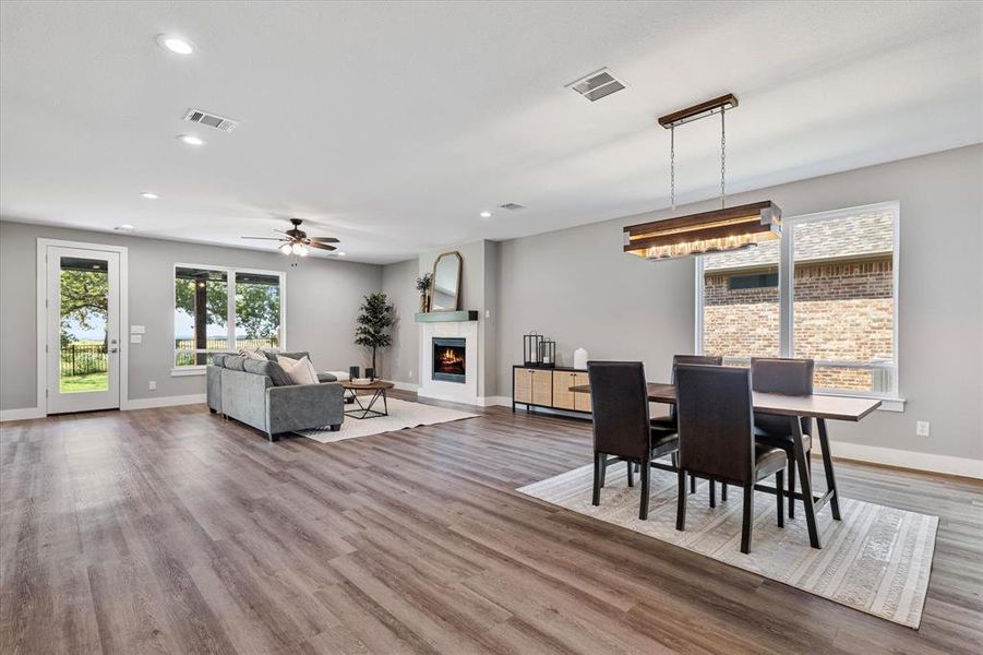 Dining area with ceiling fan and hardwood / wood-style flooring