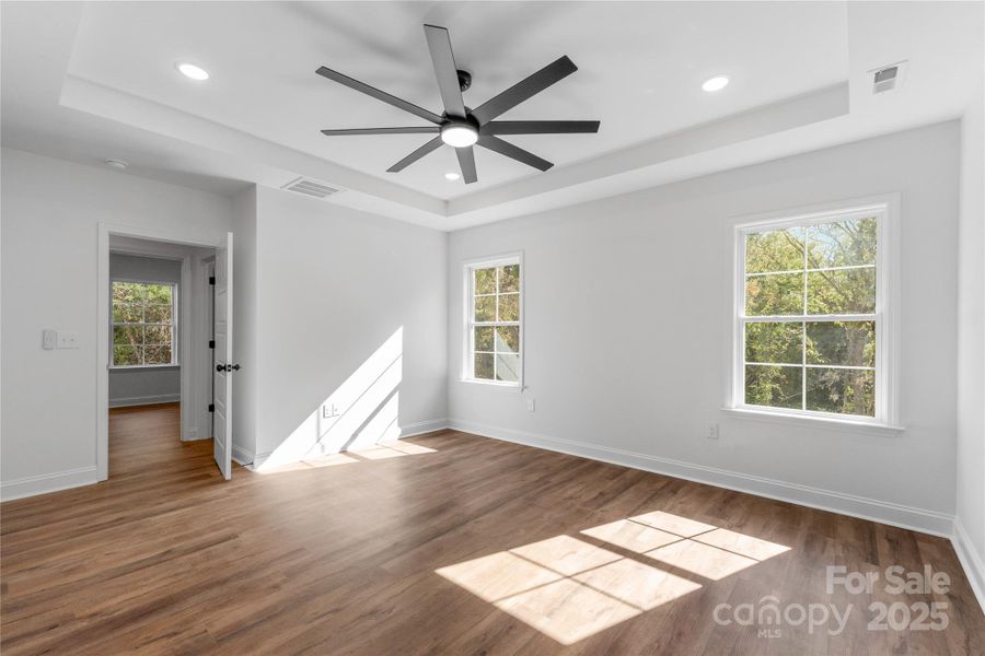 primary bedroom w/ tray ceiling primary bedroom w/ tray ceiling