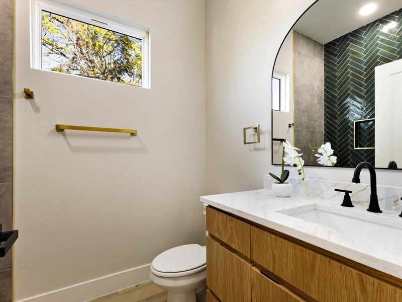 Bathroom with toilet and vanity
