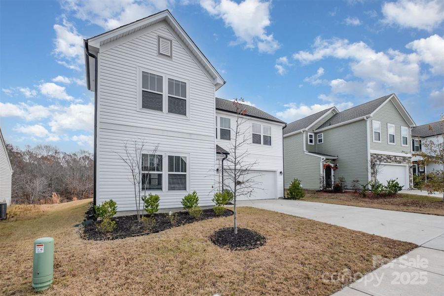 Front exterior of a new home in , Mount Holly, NC, highlighting curb appeal (Image 22).